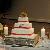 A Unique Wedding Cake accented by a beautiful rented cake stand.